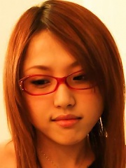Japanese babe Rino Mizusawa in glasses toying her pussy